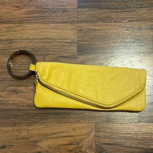 Mud pie envelope style clutch. Mustard yellow with acrylic wristlet.